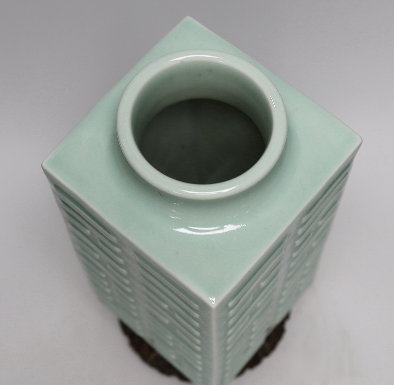 A Chinese celadon glazed eight trigrams cong vase, Guangxu mark, wood stand, 35cms high